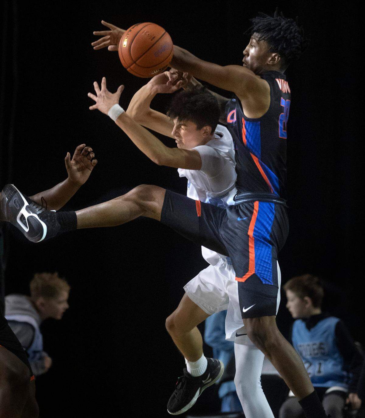 Gig Harbor’s Will Landram is smothered by Rainier Beach defender Jaelin Green as they battle in the key during Thursday afternoon’s quarterfinal game of the WIAA 3A Boys Basketball State Championships tournament in the Tacoma Dome in Tacoma, Washington, on Thursday, March 3, 2022. Rainier Beach won the game, 65-60.