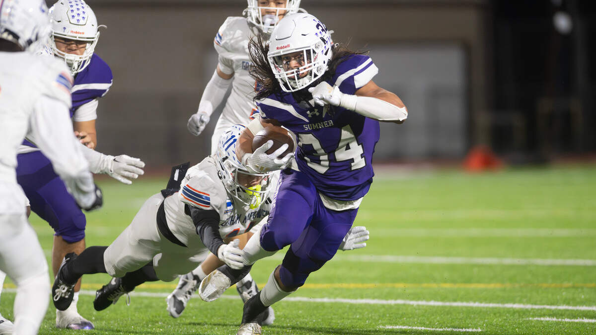 Sumner running back Steele Isaacs breaks away from Graham Kapowsin cornerback Kase Betz during Friday night’s football game at Sunset Chev Stadium in Sumner, Washington, on Nov. 1, 2024. Sumner won the game, 23-11.
