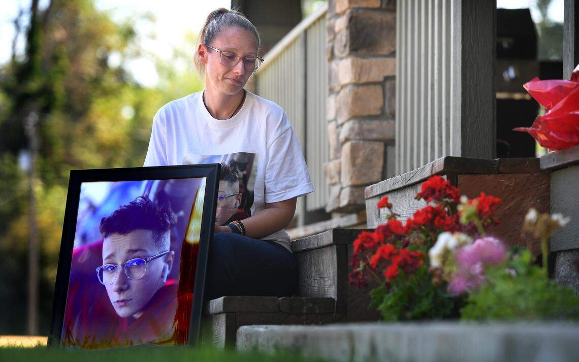 Amber Weilert sits with a photo she took of her son, Michael Weilert, at the family’s home in Parkland, Washington on Wednesday, July 27, 2022. The 13-year-old was killed July 19 when he was hit by a car while riding his bicycle through a crosswalk near his home.