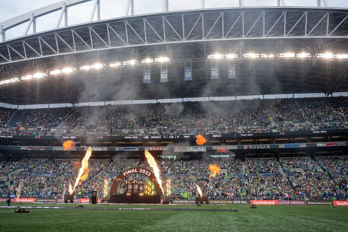Pyrotechnics explode around a DJ before a CONCACAF Champions League match at Lumen Field in Seattle earlier this month.