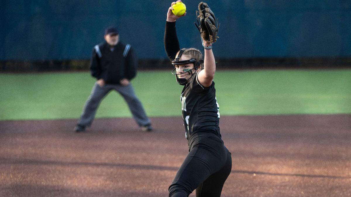 Kentwood pitcher Sarah Wright (9) pitchs during the second inning of a non-conference varsity softball game against Auburn Riverside at Auburn Riverside High School in Auburn, Wash. on April 25, 2023. Kentwood defeated Auburn Riverside 3-0.