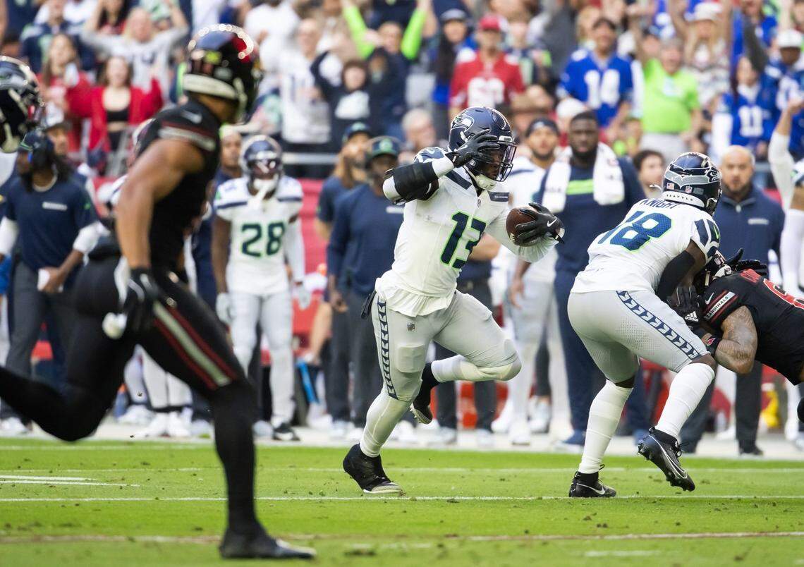 Dec 8, 2024; Glendale, Arizona, USA; Seattle Seahawks linebacker Ernest Jones IV (13) returns an interception against the Arizona Cardinals in the first half at State Farm Stadium. Mandatory Credit: Mark J. Rebilas-Imagn Images