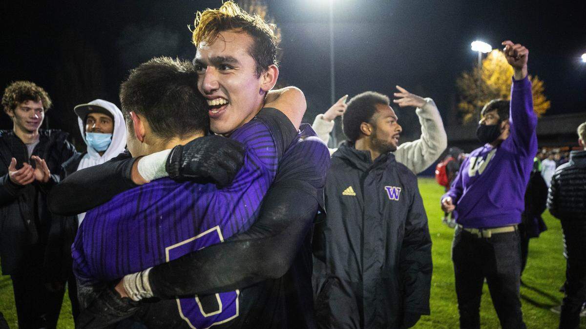 Gio Miglietti (facing camera) hugs his Husky teammates after scoring both goals in a 2-0 win over St. Louis to advance to the College Cup in North Carolina this week. The St. Louis University Billikens played the University of Washington Huskies in NCAA Soccer quarterfinals action Saturday, Dec. 4, 2021 at Husky Soccer Stadium, In Seattle, WA.