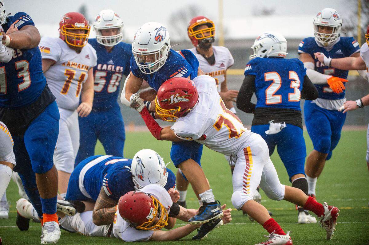 Graham Kapowsin running back Zack Lee barrels through Kamiakin’s Angel Salgado for a touchdown in the fourth quarter of a State 4A semifinal game on Saturday afternoon at Art Crate Field in Spanaway.