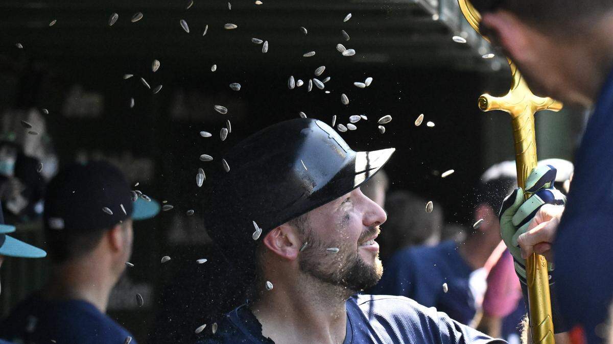 Jun 20, 2025; Chicago, Illinois, USA;  Seattle Mariners catcher Cal Raleigh (29) celebrates in the dugout after hitting a two run home run against the Chicago Cubs during the seventh inning at Wrigley Field. Mandatory Credit: Matt Marton-Imagn Images