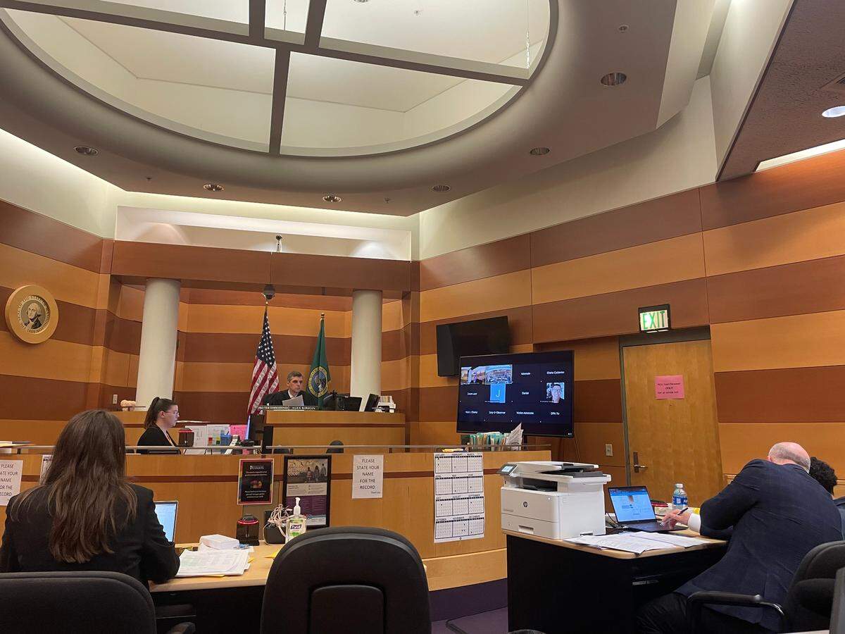 A 16-year-old boy (far right) appears for arraignment Friday, June 30, 2023 in Pierce County juvenile court to face charges of vehicular homicide and unlawful possession of a stolen vehicle. He’s accused of fleeing from Lakewood police Thursday morning as a suspect in a robbery, then crashing into a semi-truck, killings its driver.