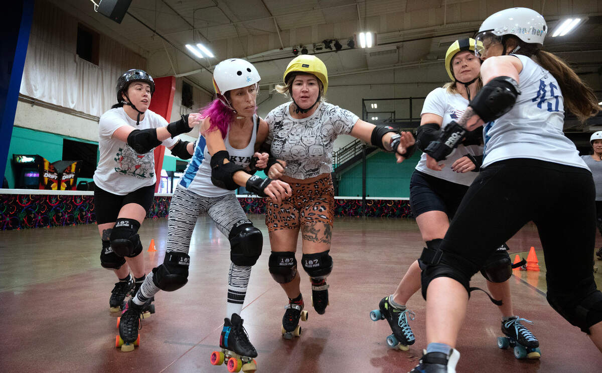 Dockyard Derby Dames skaters (from left) Calamaty Chlo, SkaterzOphrinic, Cole Hearted, Rat Attack and Clarity during roller derby practice at Skateworld Tacoma in Fircrest, Washington, Wednesday, Oct. 25, 2023.