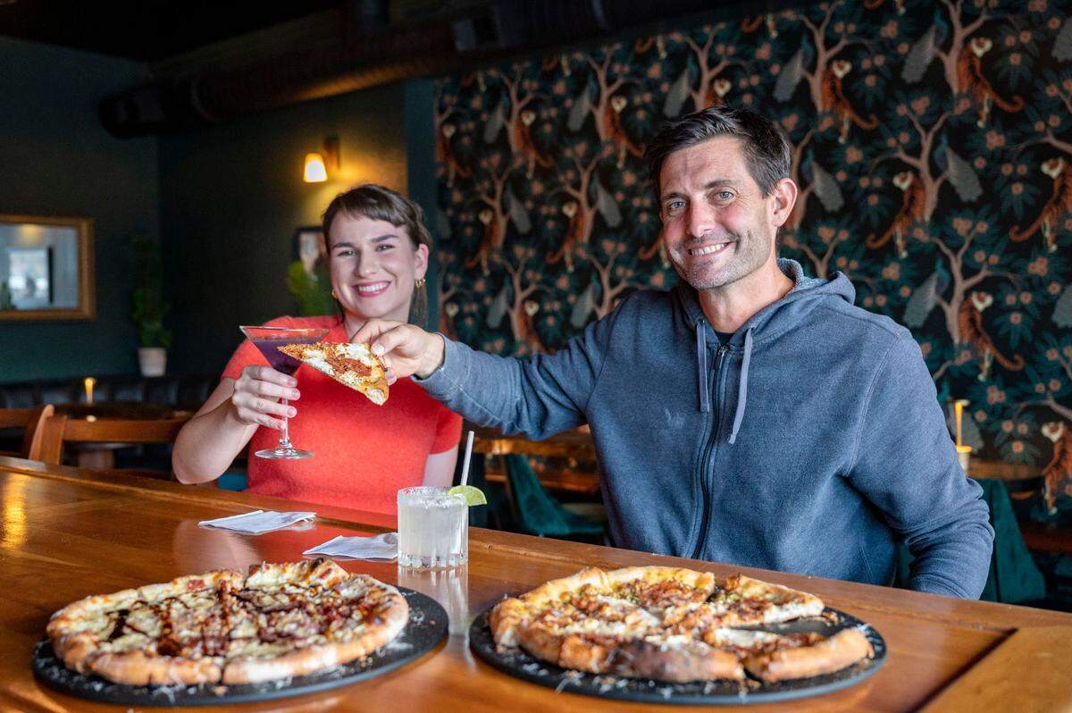 Riley Haizlip (left) co-owns and manages The Blind Pig, where Millhouse’s signature brand of pizzas and panuozzos are available alongside classic cocktails. John Ross (right) also owns Millville Pizza Co. in Gig Harbor with spouse Alyssa Ross.