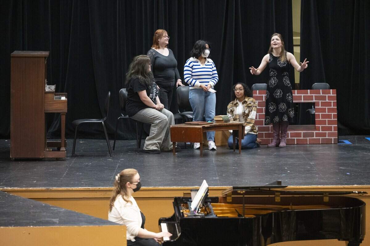 The March family gathers in their living room during a rehearsal of musical Little Women on Wednesday, June 3, 2026, at Tacoma Community College in Tacoma, Wash. The musical is the first fully-staged production at TCC in more than 30 years.