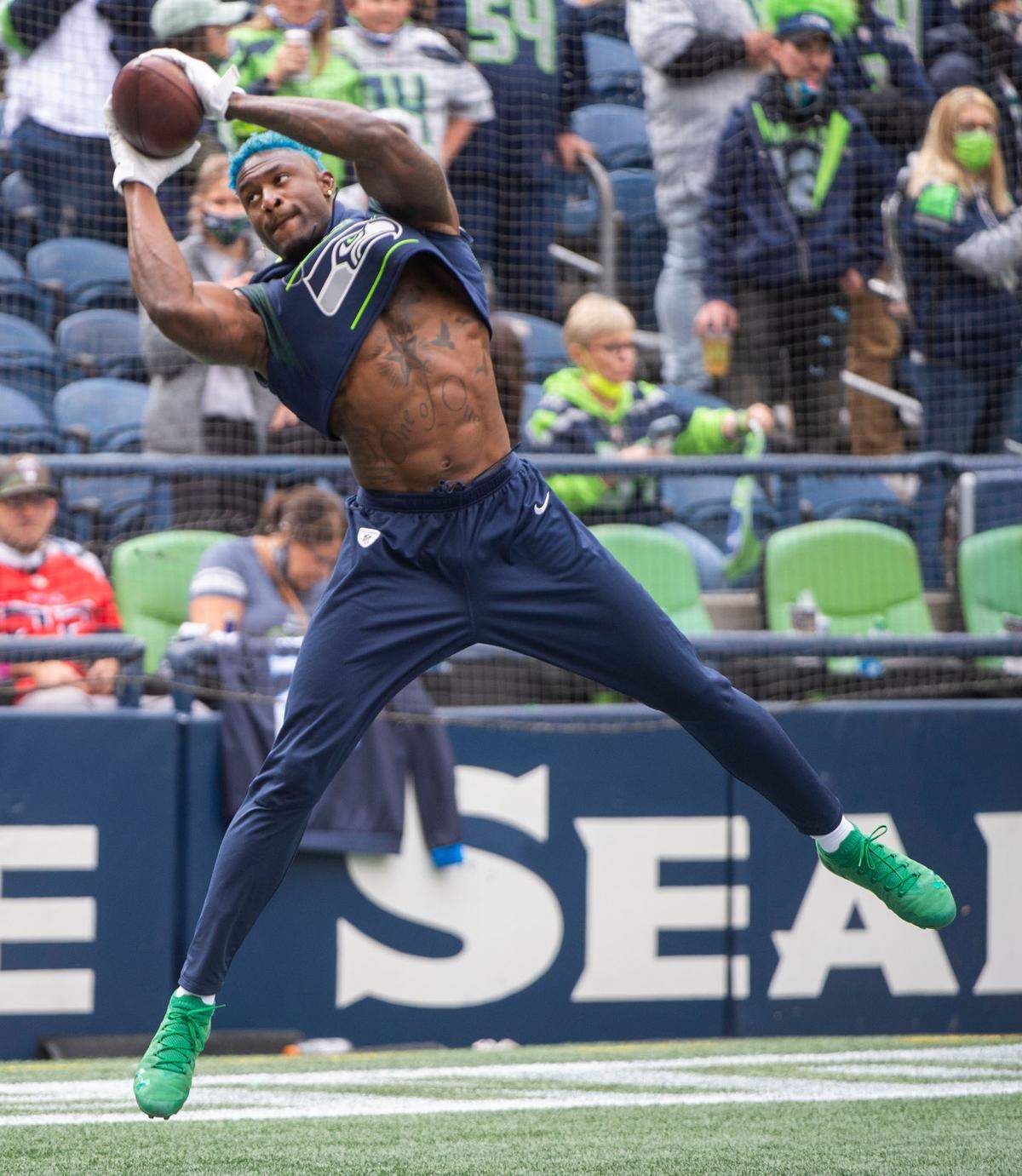 Pro Bowl wide receiver DK Metcalf warms up prior to the Seattle Seahawks playing the Tennessee Titans in an NFL football game at Lumen Field in Seattle, Wash., on Sunday, Sept. 19, 2021.