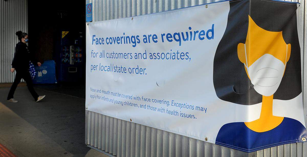 People entering the Yelm Walmart store early Monday morning are immediately reminded of the new statewide COVID mask requirement, which took effect on Aug. 23.