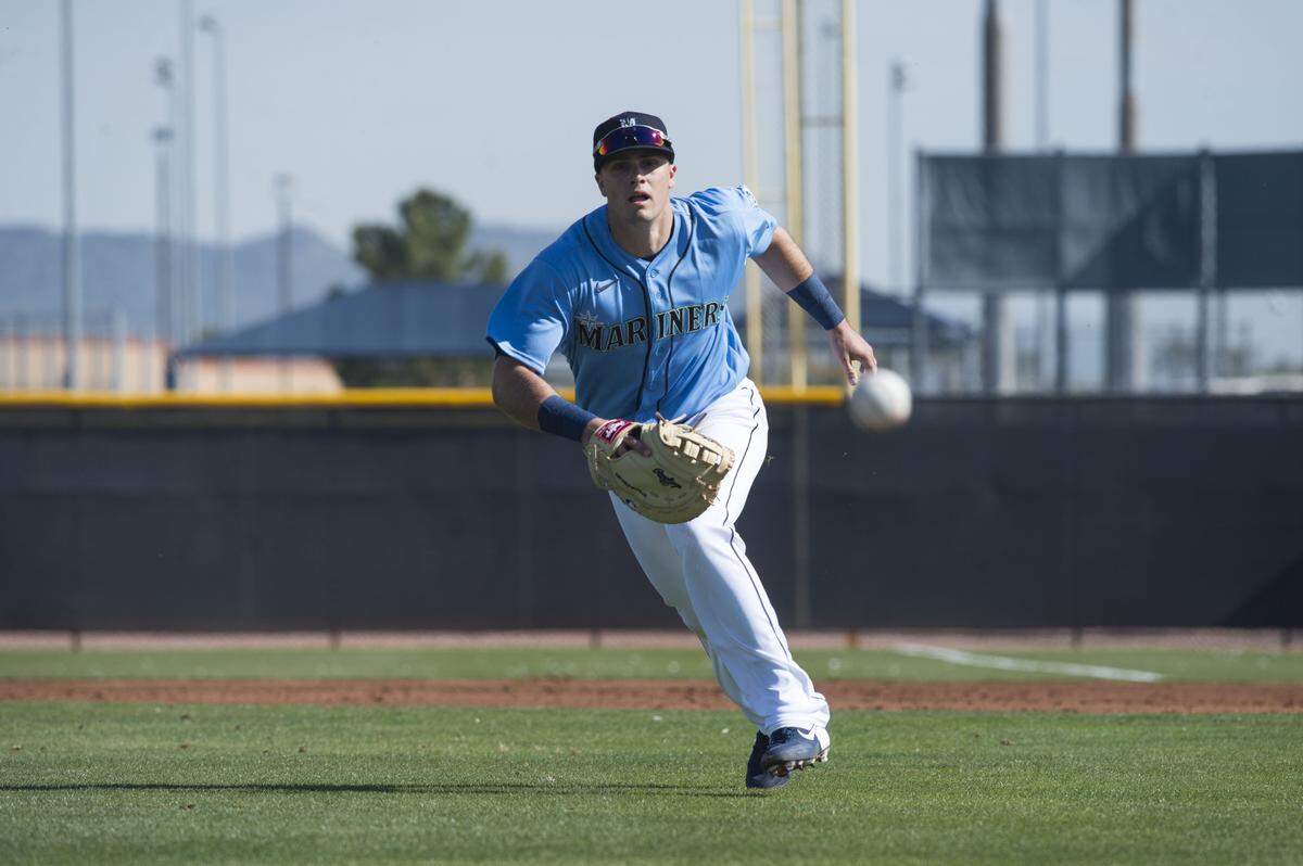 Seattle Mariners first baseman Evan White runs through a fielding drill at spring training on Tuesday, Feb. 18, 2020 in Peoria, Ariz.