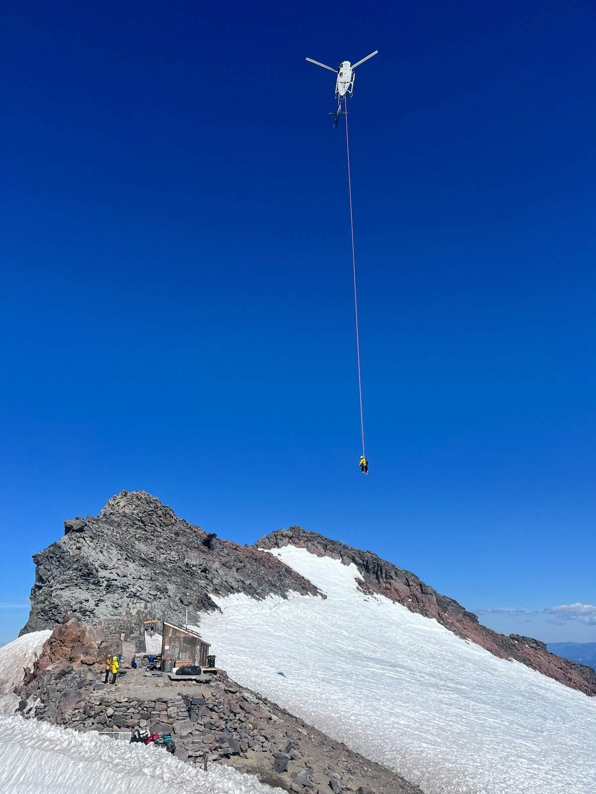 Mount Rainier rangers on a “short haul” mission near Camp Muir.