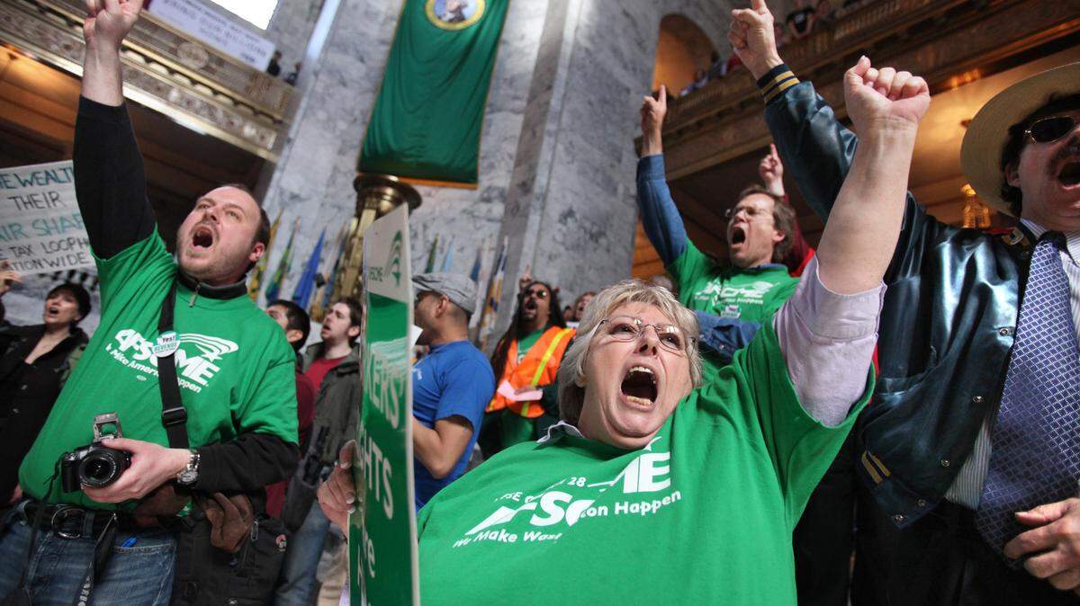Labor union members from around Washington make their voices heard inside the state Capitol Rotunda during a rally in 2011.