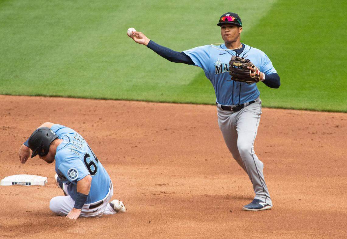 Mariners shortstop Noelvi Marte turns a double play during a Seattle Mariners taxi squad game at T-Mobile Park in Seattle, Wash., on Friday, July 24, 2020.