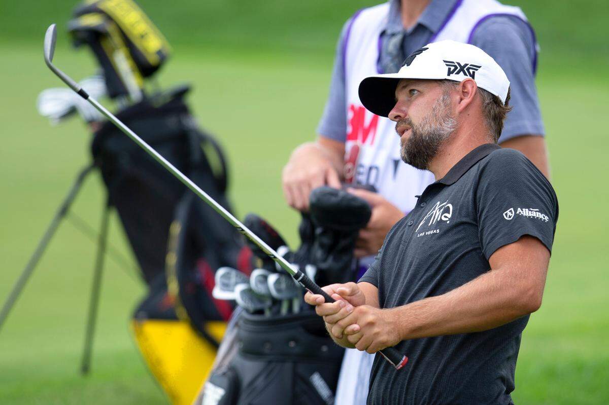 Ryan Moore watches his shot on the 18th hole during the first round of the 3M Open golf tournament in Blaine, Minn., Thursday, July 23, 2020. (AP Photo/Andy Clayton- King)