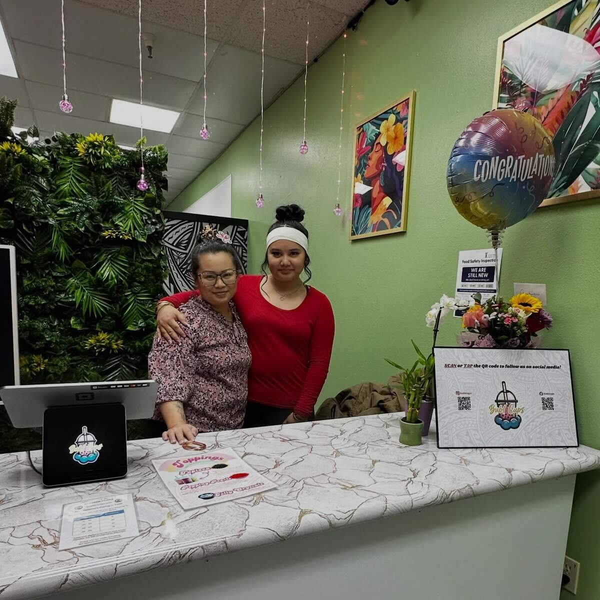 Heather Lizama and her 16-year-old daughter, Ava Lizama, run Bubl Cups, a small family-run boba shop in the Town Square shopping mall in Port Orchard, Wash. The store will host its grand opening Saturday, March 21, 2026.
