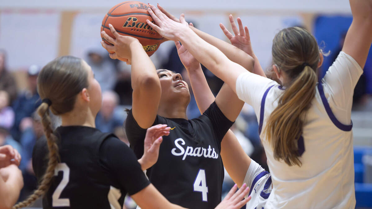 Sumner’s Kawehi Borden gets blocked rejected by Lake Washington defender Julia Benthin as they Kangaroos handed the Spartans a 58-47 defeat during “The Dream Showcase” MLK basketball tournament at Federal Way High School in Federal Way, Washington, on Monday, Jan. 20, 2025.