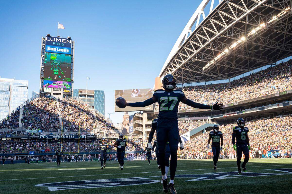Seattle Seahawks cornerback Tariq Woolen (27) celebrates after recovering a fumble by Arizona Cardinals quarterback Kyler Murray (1) during the third quarter of an NFL game on Sunday, Oct. 16, 2022, at Lumen Field in Seattle.