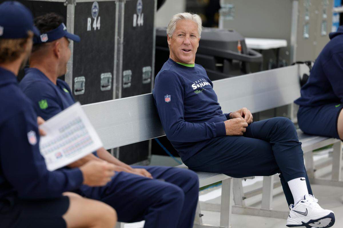 Seattle Seahawks head coach Pete Carroll sits on the bench before a preseason NFL football game against the Green Bay Packers, Saturday, Aug. 26, 2023, in Green Bay, Wis. (AP Photo/Matt Ludtke)