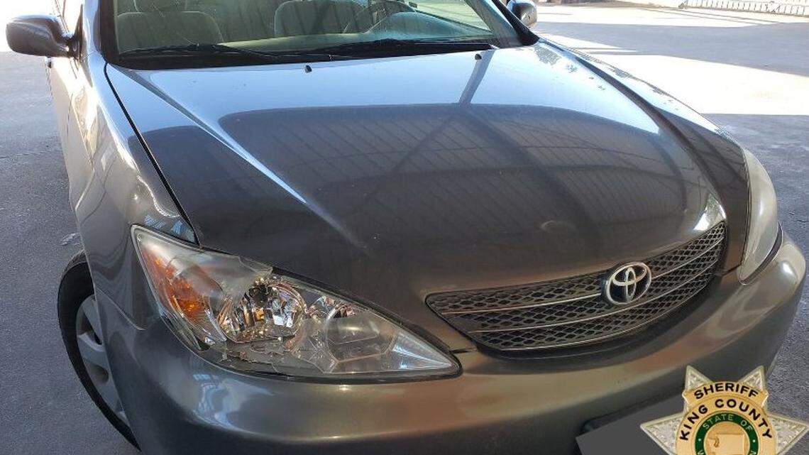 A Toyota Camry with a cracked headlight is shown on Sept. 8, 2021. Officials said the car matched the vehicle caught on surveillance footage the day a man was killed by a hit-and-run driver.