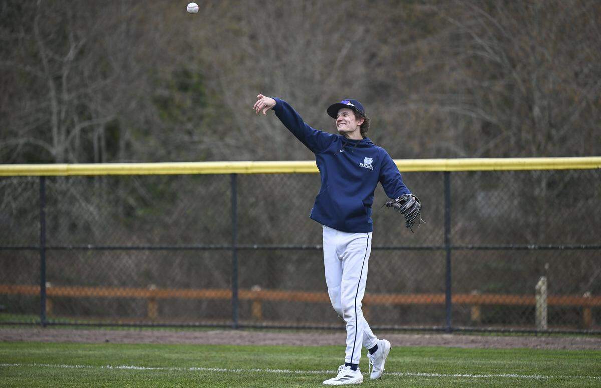 Gig Harbor shortstop Hunter Payne throws during warm ups on Monday, March 9, 2026, at a practice in Gig Harbor.