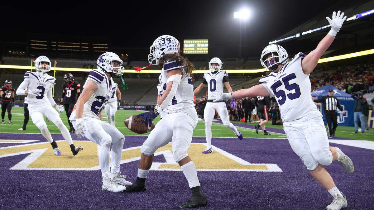 Sumner players (from left) Kainoa Grounds, Nate Carnahan, Steele Isaacs, Braylen Pope and Preson Weir-Moses celebrate Isaacs’ touchdown run during the WIAA 4A state football championship game against the Camas Papermakers at Husky Stadium in Seattle, Washington, on Dec. 7, 2024. Sumner won the game on a last second field goal, 27-24.