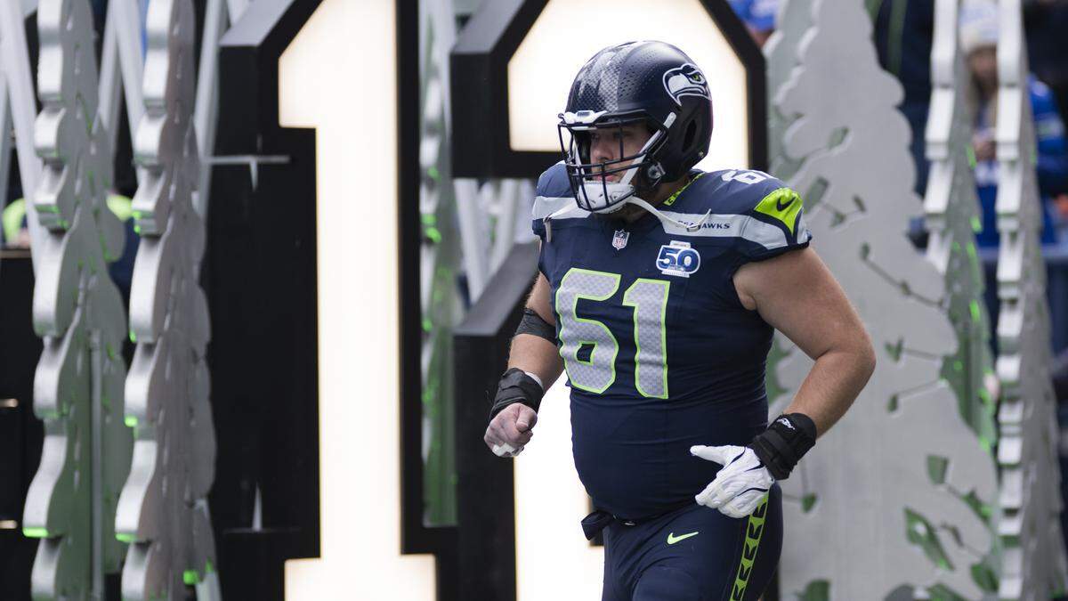 Seattle Seahawks center Jalen Sundell (61) runs out before the game against the Indianapolis Colts at Lumen Field, on Sunday, Dec. 14, 2025, in Seattle.