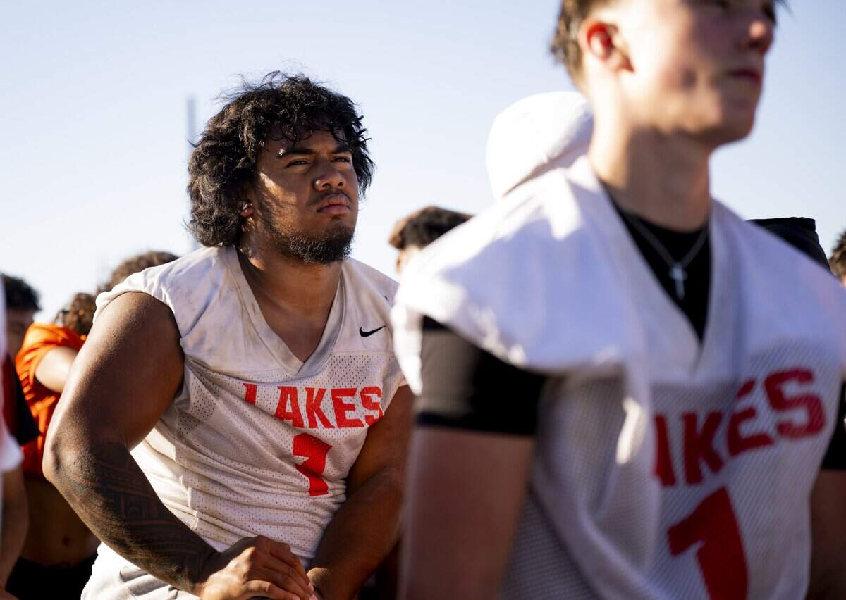 Lakes defensive end Tupu Saeumealua listen in the huddle on the end of a football practice at Lakes High School on Wednesday, Aug. 20, 2025, in Lakewood, Wash..