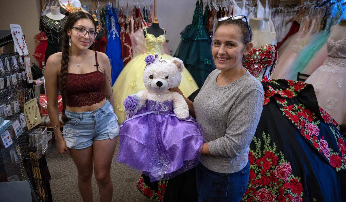 Wendy Medina (right) and her daughter, Julia Ramos, at their Anita’s Boutique quincenera and celebrations store in Tacoma, Washington, on Monday, Aug. 14, 2023.