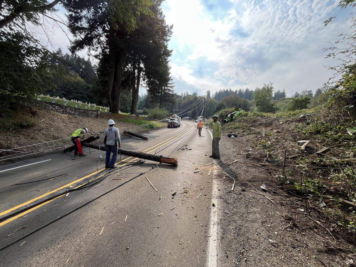 Power lines were down after a Dodger Hellcat crashed off the side of Orting Kapowsin Highway East on Friday, Sept. 5, 2025 near Orting, Wash.