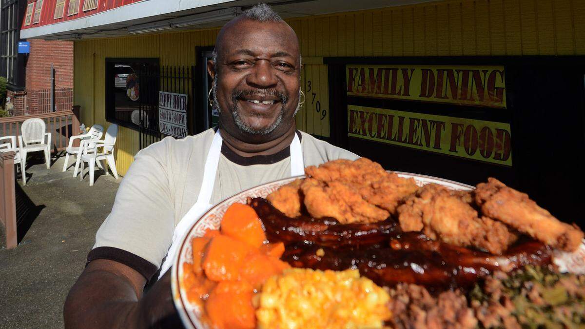 Thurmond Brokenbrough holds a sample platter from Uncle Thurm’s Soul Food on Mar. 10, 2013. The Lincoln District restaurant closed recently.
