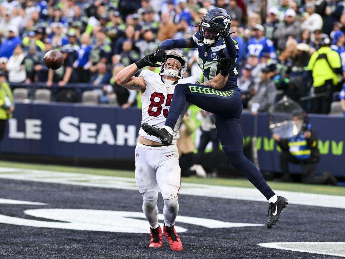 Seattle Seahawks cornerback Riq Woolen (27) breaks up the end zone shot intended for Arizona Cardinals tight end Trey McBride (85) during the third quarter of the game at Lumen Field, on Sunday, Nov. 9, 2025, in Seattle.