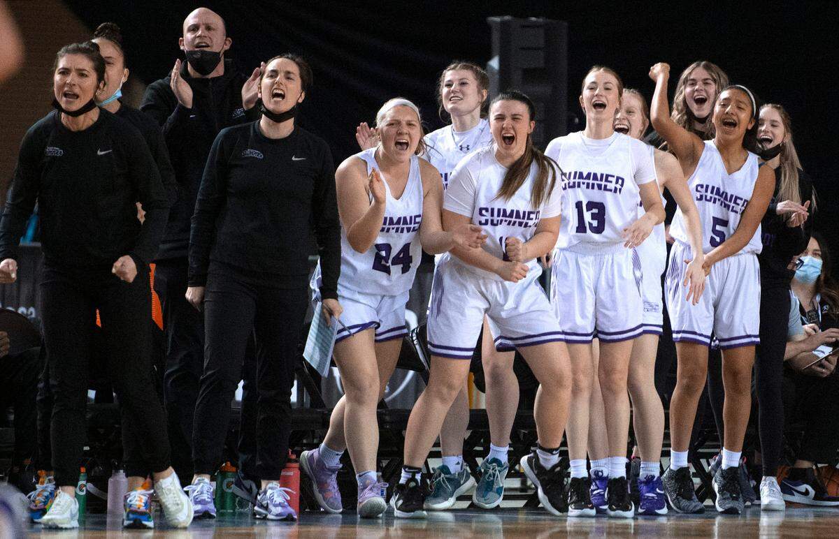 The Sumner bench cheers on the Spartans against the Pasco Bulldogs in Friday evening’s semifinal game of the WIAA 4A Girls Basketball State Championships tournament in the Tacoma Dome in Tacoma, Washington, on Friday, March 4, 2022.