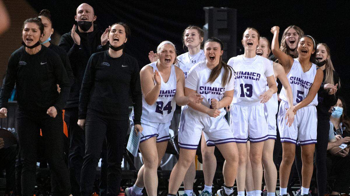 The Sumner bench cheers on the Spartans against the Pasco Bulldogs in Friday evening’s semifinal game of the WIAA 4A Girls Basketball State Championships tournament in the Tacoma Dome in Tacoma, Washington, on Friday, March 4, 2022.