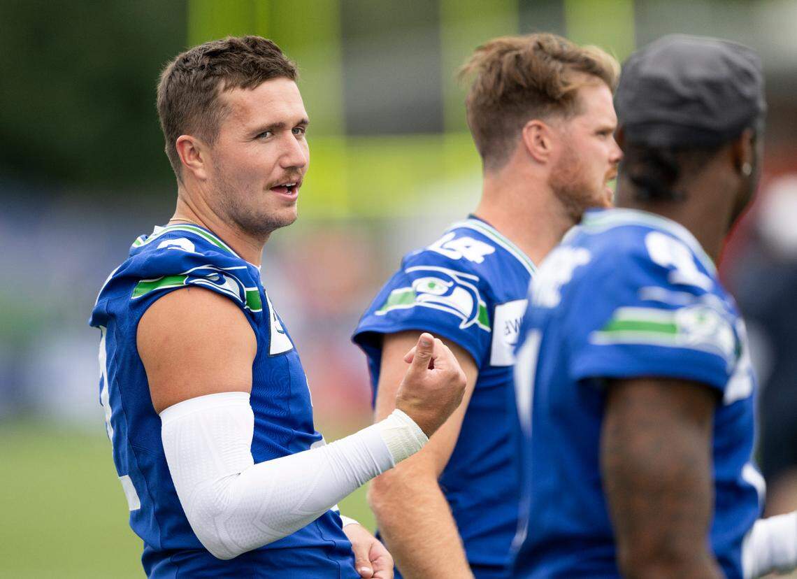 Seattle Seahawks quarterback Drew Lock (2) talks with Seattle Seahawks quarterback Jalen Milroe (6) during training camp at Virginia Mason Athletic Center on Friday, July 25, 2025, in Renton, Wash.