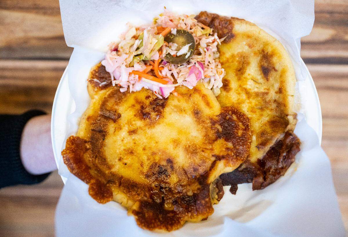 Balcon Express makes hundreds of pupusas in-house daily, filled with spinach and cheese, pork and cheese, or the popular revueltas — a combination of pork, cheese and refried beans.