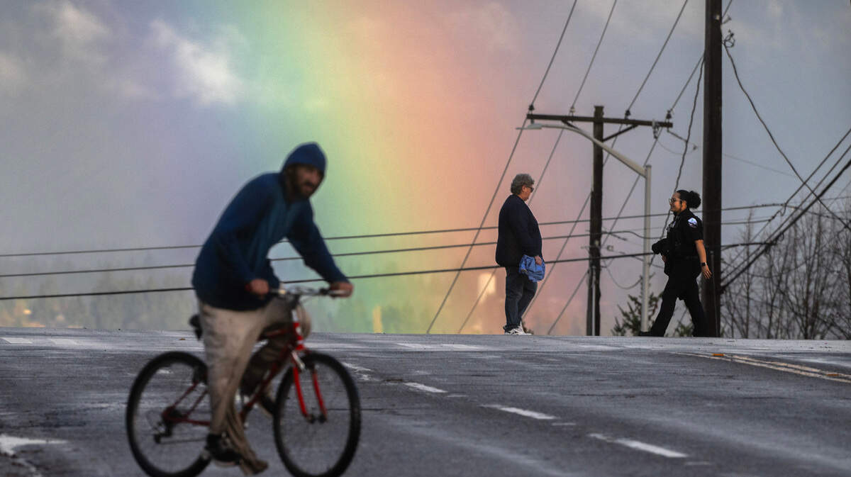A rainbow lights up the sky over 19th Street in Tacoma, Washington, on Thursday, Nov. 14, 2024.