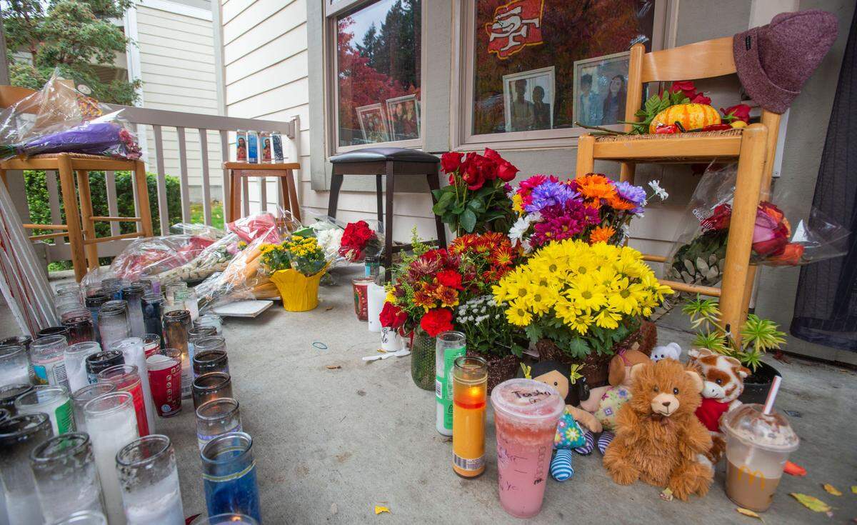 A memorial grows for the four victims – Maria Nunez, Emery Iese, Raymond Williams and Natasha Brincefield – who were murdered in a mass shooting at the home of a family matriarch in Tacoma’s Salishan neighborhood Oct. 21, 2021.