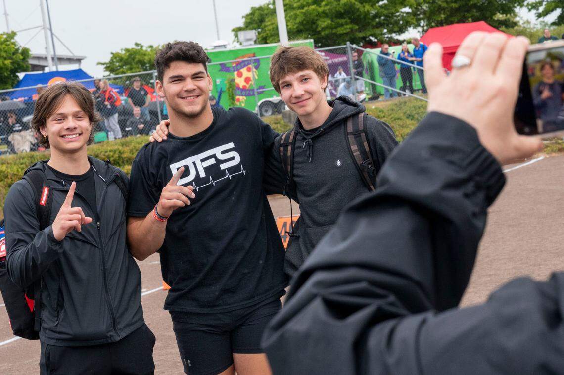 Yelm’s Brayden Platt celebrates with teammates after winning the 3A boys shot put at the State 2A, 3A, 4A track and field championships on Thursday, May 26, 2022, at Mount Tahoma High School in Tacoma Wash.