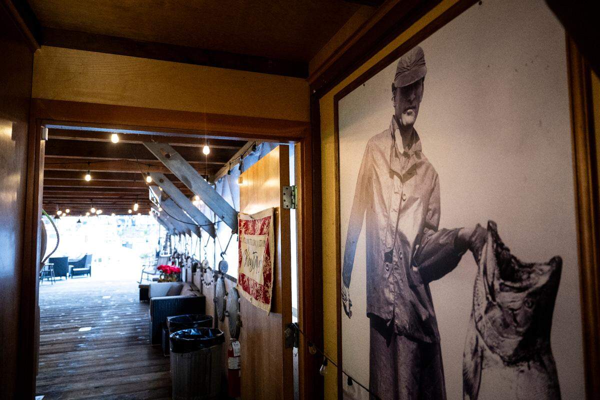 Brad Bailey and his wife have renovated the Babich netshed, keeping much of the old charm but making it a “boat-tel,” where people can stay overnight in one of the boats.