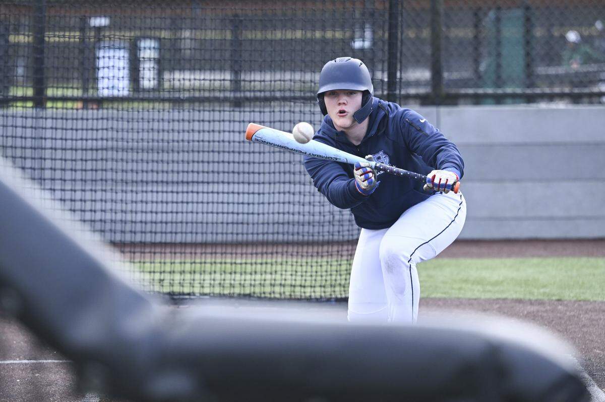 Gig Harbor pitcher Jake Cuda runs a bunting drill during practice on Monday, March 9, 2026, in Gig Harbor, Wash.