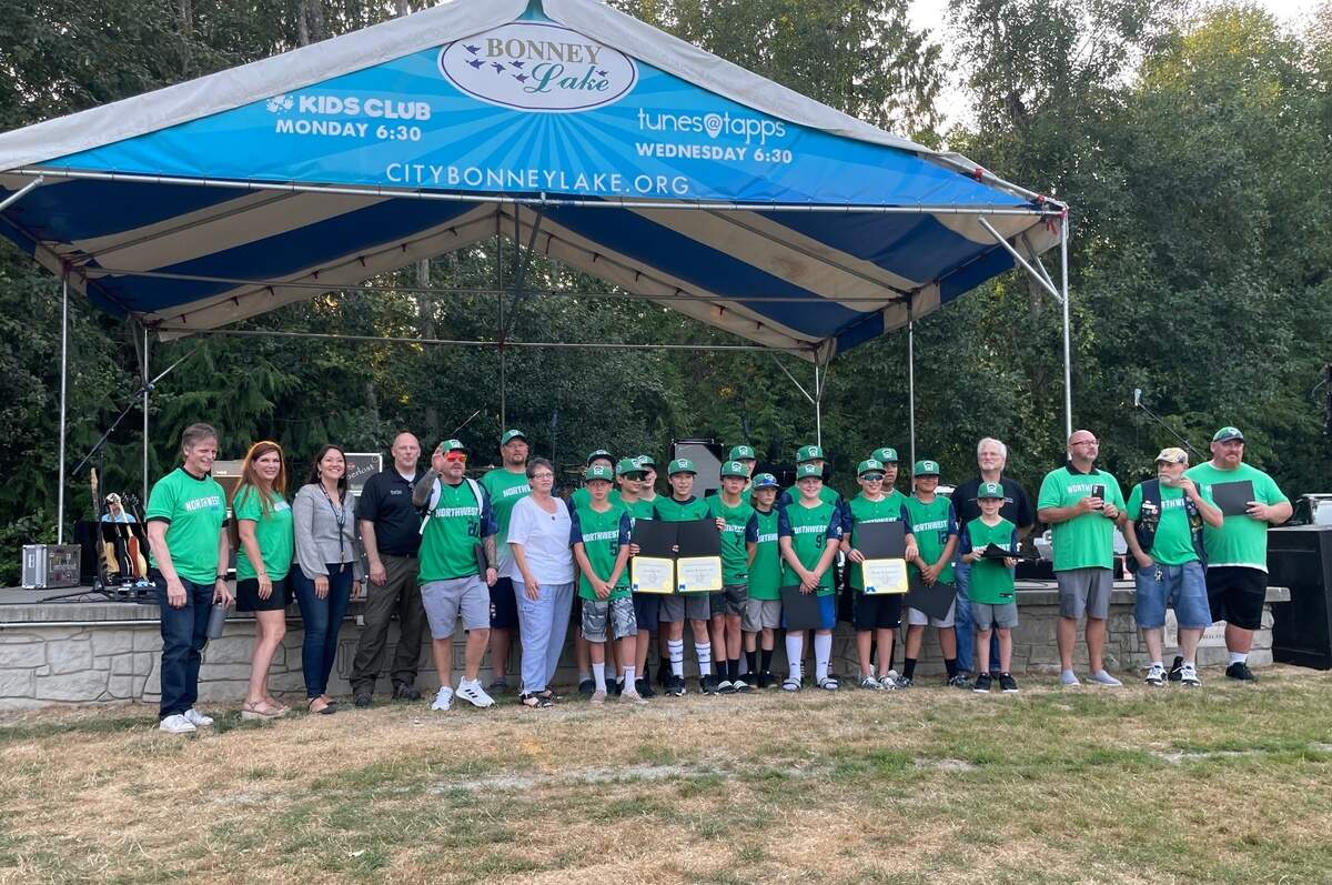 The Bonney Lake-Sumner Little League 12-and-under all stars pose with their coaches and local politicians at the Tunes @ Tapps concert stage. The players received awards for being the first Pierce County team to qualify for the Little League World Series earlier this summer.
