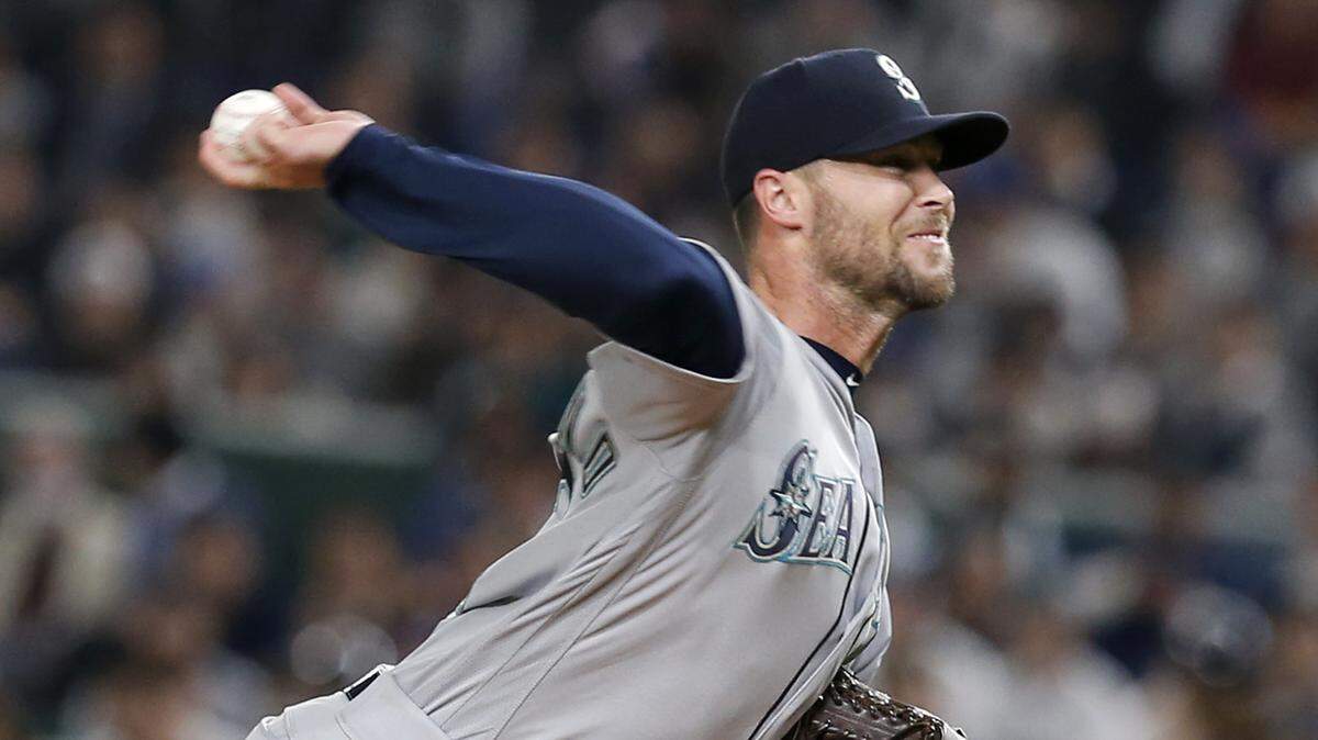 Seattle Mariners closer Hunter Strickland pitches against the Oakland Athletics in the ninth inning of Game 1 of their Major League opening series baseball game at Tokyo Dome in Tokyo, Wednesday, March 20, 2019. The Mariners won 9-7. (AP Photo/Toru Takahashi)