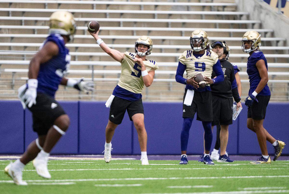 University of Washington Huskies quarterback Dylan Morris, 5, throws the ball during a drill at the first day of Fall practice at Husky Stadium on Thursday, Aug. 4, 2022 in Seattle, Wash.