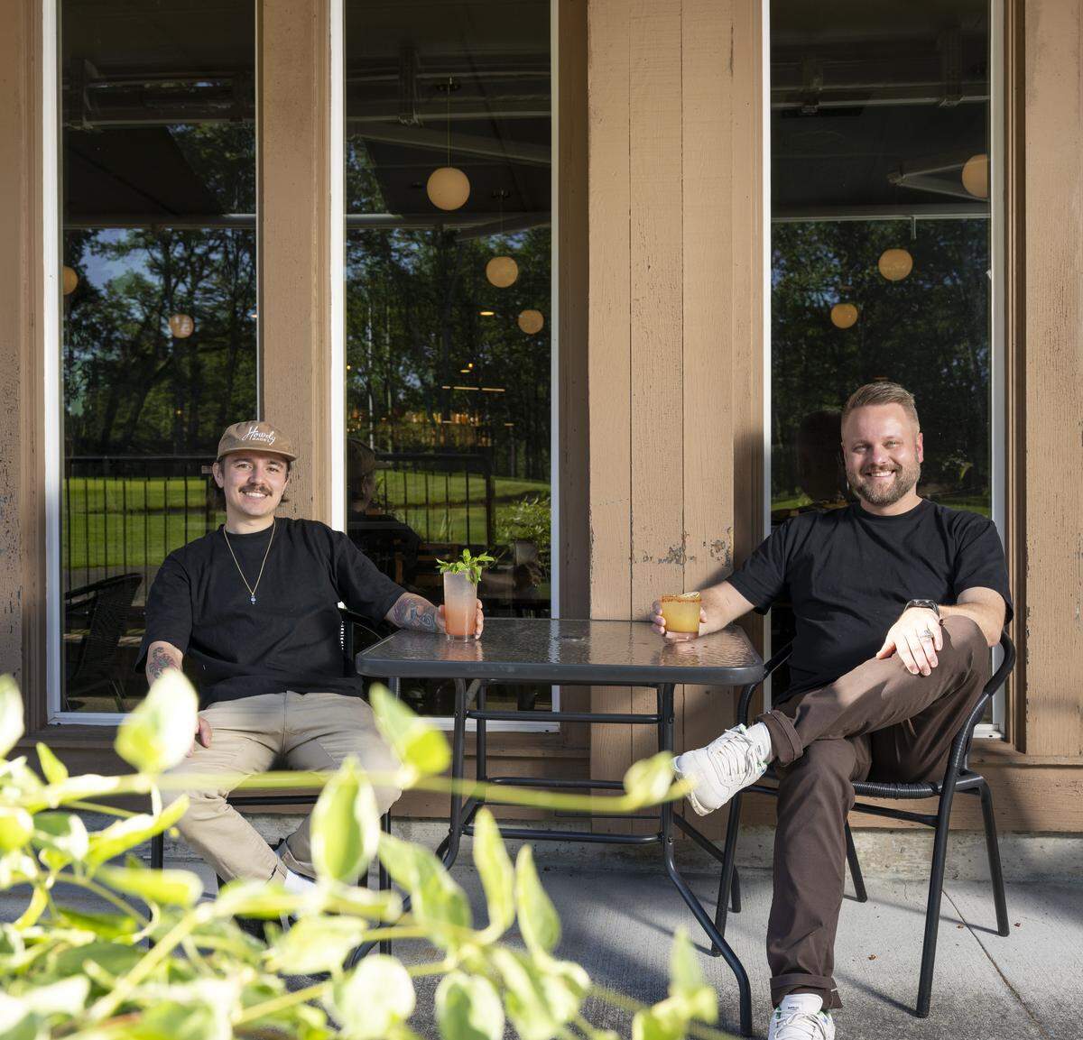 Restaurant general manager James Padilla and club co-owner Jason Moore sit on the patio of The Edit Social House on Thursday, May 21, 2026, at the Oakbrook Golf Club in Lakewood, Wash.
