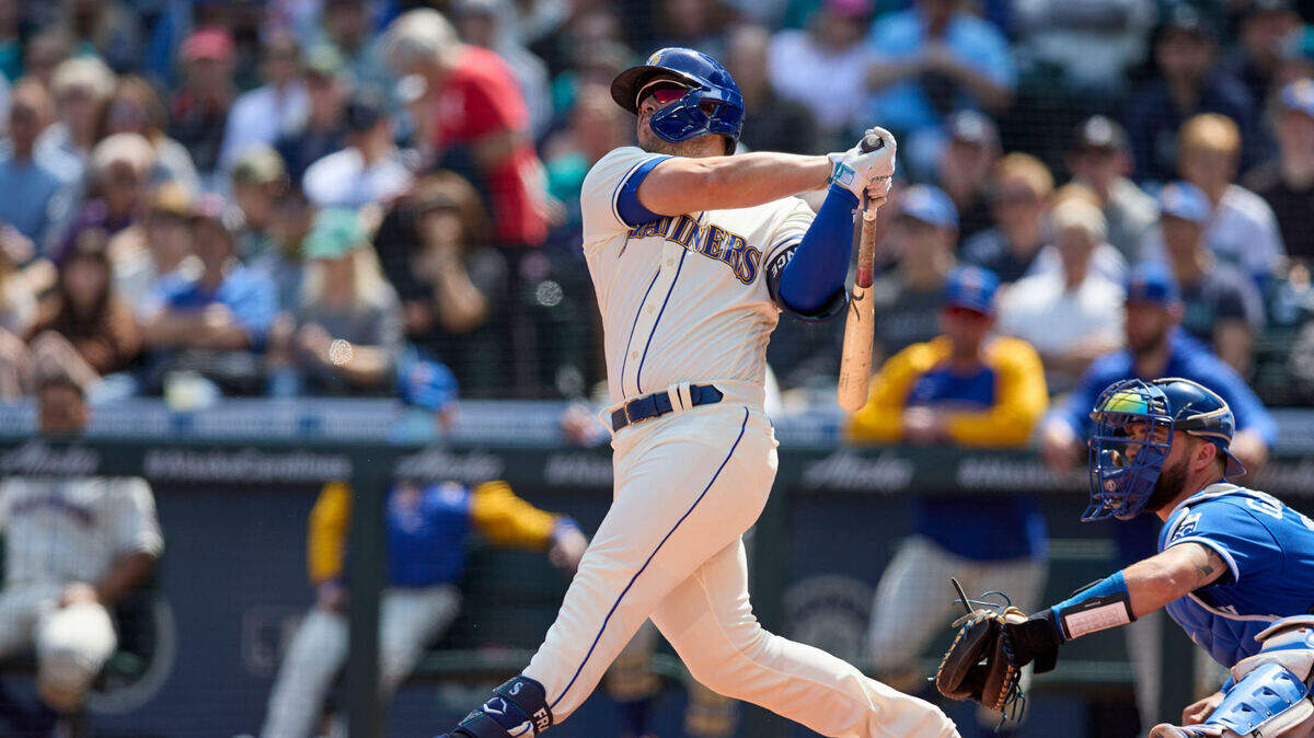 Seattle Mariners’ Ty France hits a two-run home run on a pitch from Kansas City Royals starter Carlos Hernandez during the first inning of a baseball game, Sunday, April 24, 2022, in Seattle. (AP Photo/John Froschauer)