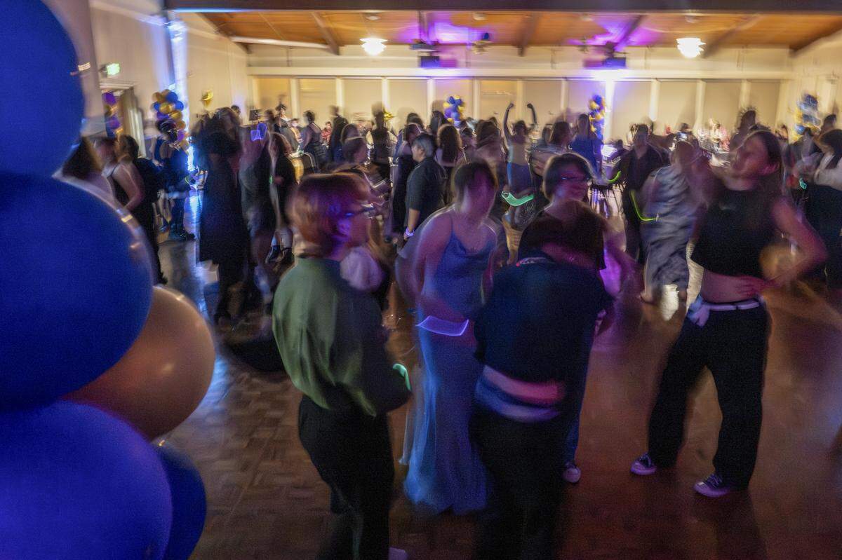 The dance floor at Queer Prom fills as a Lady Gaga song plays on Saturday, April 18, 2026, at Pacific Lutheran University in Tacoma.