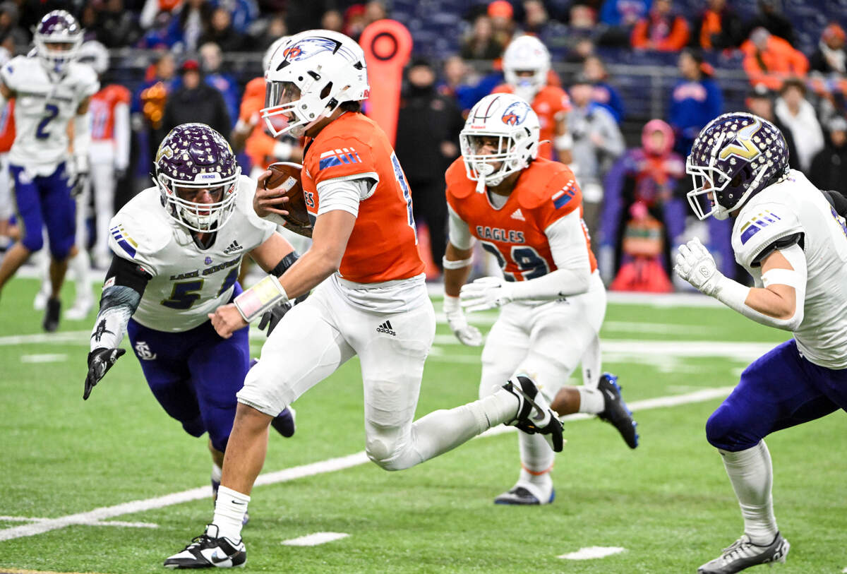 Graham-Kapowsin’s Daveon Superales (15) keeps the ball during the first half of the 4A state championship game against Lake Stevens at Husky Field, Saturday, Dec. 2, 2023, in Seattle, Wash.