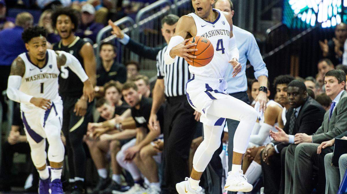 University of Washington guard Matisse Thybulle (4) tries to keep a stolen pass inbounds in the first half. The Washington Huskies played the Colorado Buffaloes in a NCAA basketball game at Her Edmundson Pavilion in Seattle, Wash., on Saturday, Feb. 23, 2019.